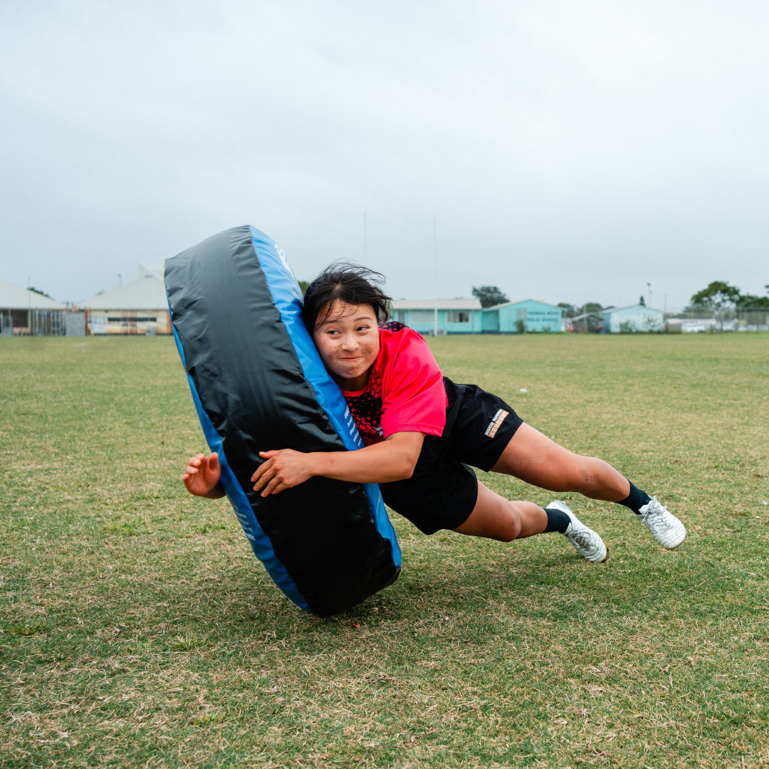 Silver Fern Rugby Tackle Tube being Tackled in Action