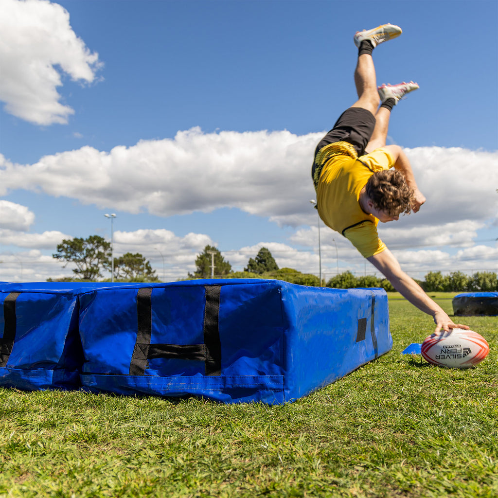 Silver Fern Folding Tackle Mat, lifestyle shot, player diving onto mat